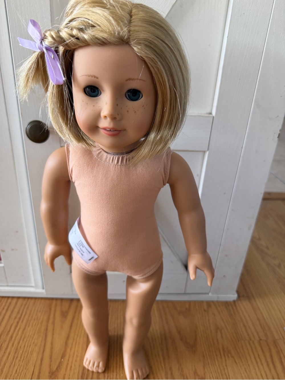 American Girl Blonde Hair Doll with Peach Bodysuit and Lavender Bow